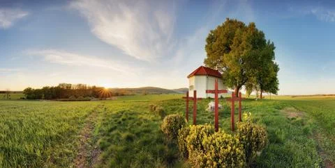 Lonely chapel in farm fields in spring day Stock Photos