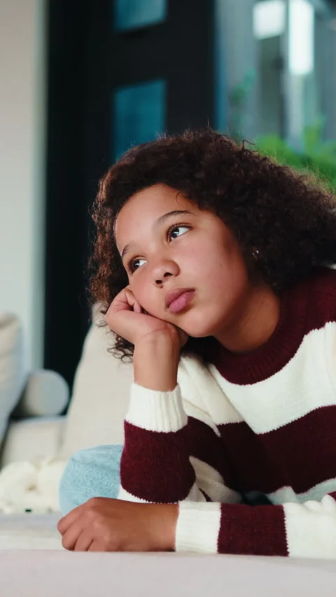 Lonely, child and thinking on couch in home, moody and remember memory on break Stock Footage 335790832