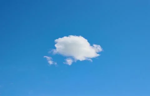 Lonely cloud in the blue sky. Stock Photos