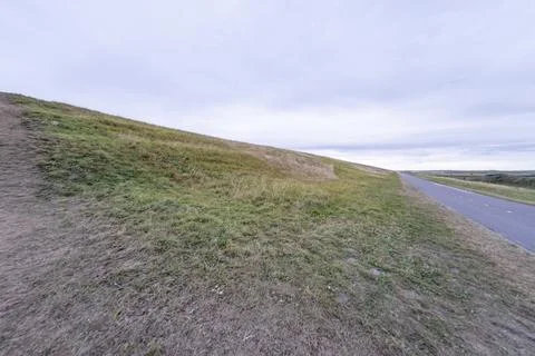 Lonely cycle path and road in the Schoorlse Duinen, Netherlands Stockfoto's