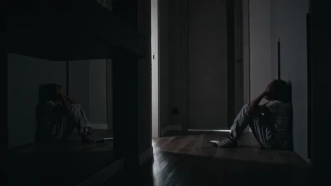 Lonely, Depressed Black Boy Using Smartphone in Dimly Lit Hallway at Home 스톡 동영상 307768060