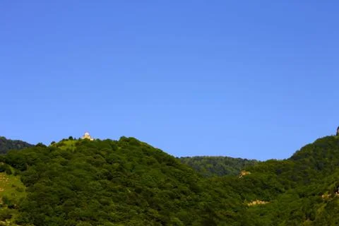 Lonely distant monastery on the top of mountain Stock Photos