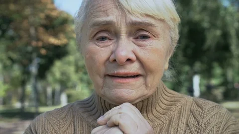 Lonely elderly lady crying thinking of problem, aged widow feeling hopelessness Stock Footage 118991677