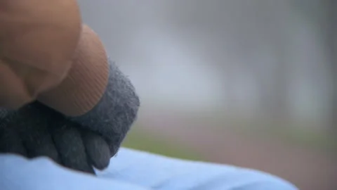Lonely elderly Man Rubs Gloved Hands Together With Worry Close Up Stock Footage 147902189