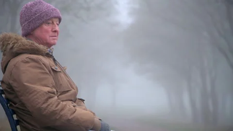 Lonely Elderly Man Sits Alone in Park Mid Shot Stock Footage 147893804