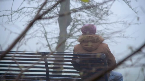 Lonely Elderly Man Sitting Alone in Park Stock Footage 147879558