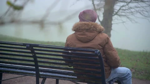 Lonely Elderly Man Sitting Alone in Park Stock Footage 147881143