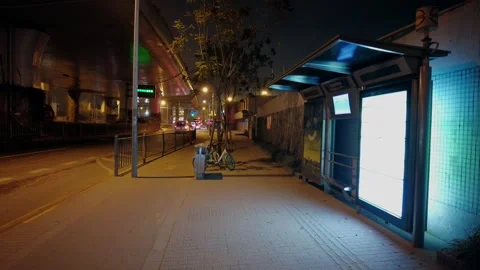 Lonely empty bus stop late at night in Shanghai Stock Footage 253216334