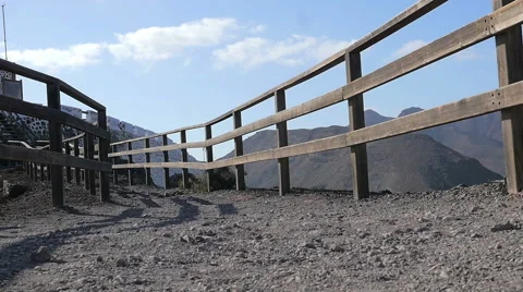 Lonely explorer walks on an empty mountain trail 스톡 동영상 67482676