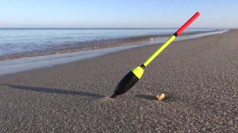 Lonely fishing float on ocean beach sand Stock Footage 43248313