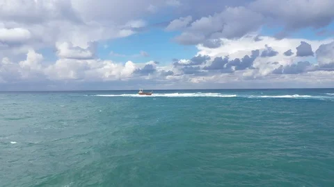 Lonely foundered ship in water Stock Footage 125954833