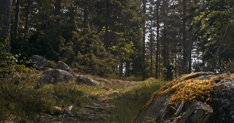 Lonely hiker jogging towards the camera 60 fps slowmotion Stock Footage 111632140