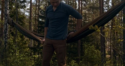 Lonely hiker lays down in a hammock Stock Footage 111645672