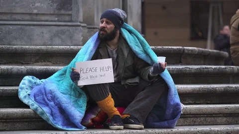 Lonely homeless sitting on the steps, asking charity someone give him coin Stock-Footage 74714106