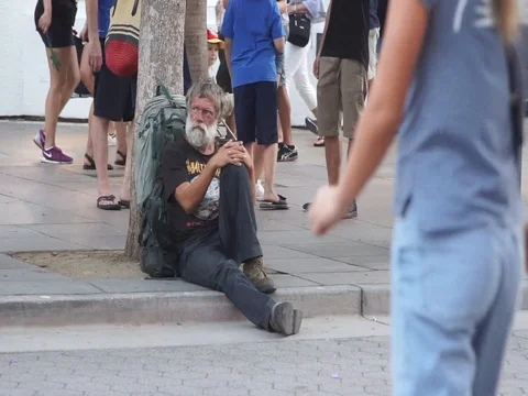 Lonely Homeless Sitting On The Street Stock Footage