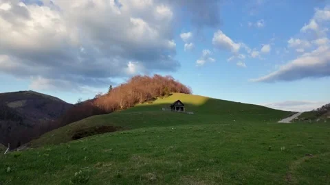 Lonely house in the mountains at sunset. Stock Footage 317634020
