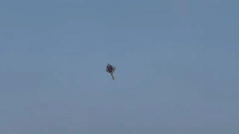 Lonely Kite Drifting in Blue Sky | Symbol of Freedom and Childhood Memories Stock Footage 332752440