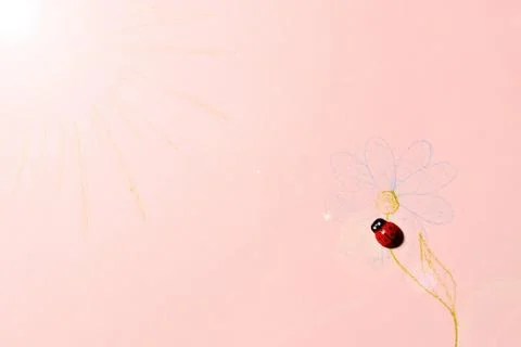 Lonely ladybug looking for the simulated sun and sitting on an artificial flower Stock Photos