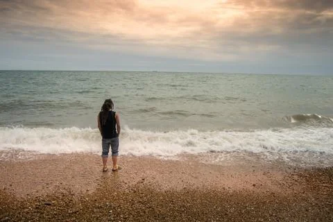 Lonely man at the beach Stock Photos