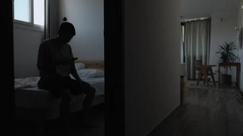 Lonely man checking phone after breakup, missing his ex Stock Footage 346606737