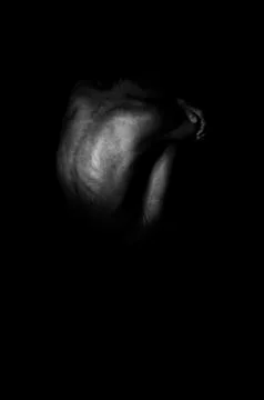 Lonely man in the dark. Stock Photos