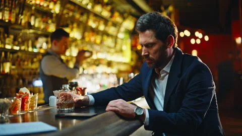 Lonely man drinking bourbon at bar counter closeup. Depressed guy life problems Stock Footage 319793152