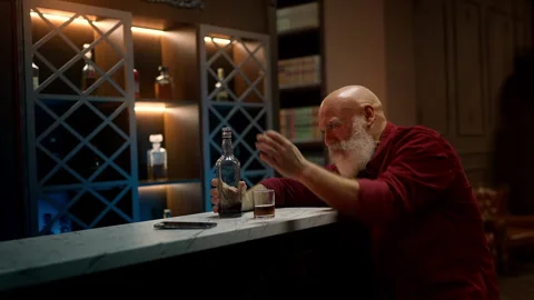 Lonely man in his 50s drinks alcohol at bar, coping with difficult life crisis Stock Footage 342520435