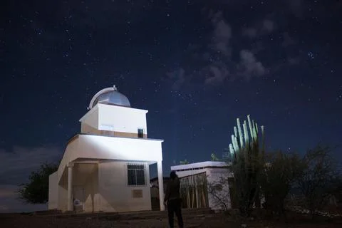 A Lonely man lighting up The Astronomical Observatory at starry night 스톡 사진