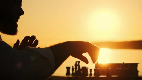 Lonely man playing chess on the beach. Stock Footage 315721711