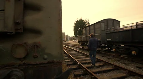 Lonely man on the rail tracks Stock Footage 54073601