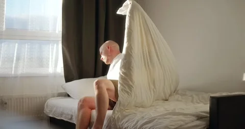 A lonely man returns home to an empty apartment after a hard day's work Stock Footage 302901197