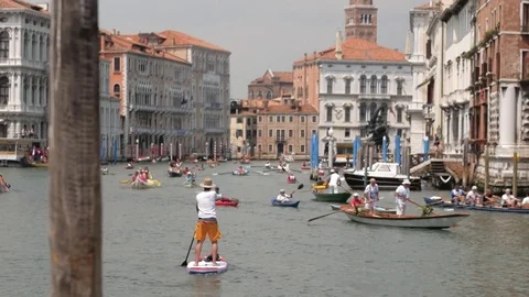 Lonely man rowing at kayaking competition. Venice, Italy. Video stock 79065532