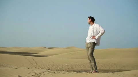 Lonely man standing in the desert HD Stock Footage 10901823