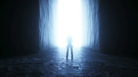A lonely man stands in front of a light portal. Realistic 4k animation. 動画素材 145925219