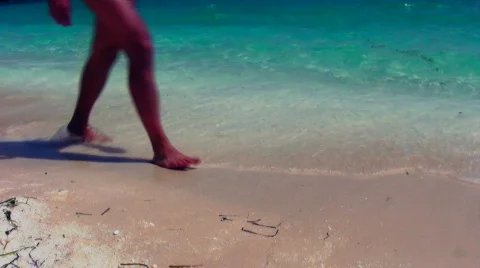 Lonely man walking on the beach Stock Footage 500674