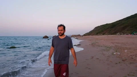Lonely man walking beach Stock Footage 238871080