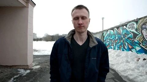 A lonely man walking forward and smiling, slow motion shot at 60fps Stock Footage 88181088