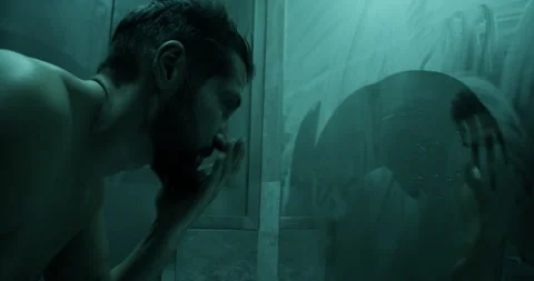 Lonely man washing face in front of mirror in bathroom Stock Footage 271159232