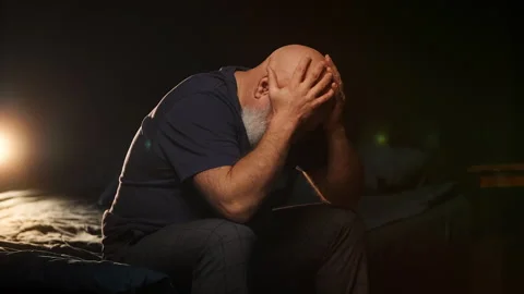 Lonely middle-aged man cries after divorce at home, coping with deep pain Stock Footage 346714277