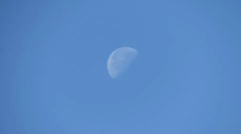 A lonely moon hangs over us Stock Photos