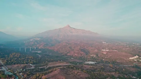 Lonely mountain overlooking the city from the drone of Marbella Spain Stock Footage 226992018