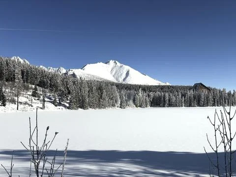 A lonely mountain in a winter landscape Stock Photos