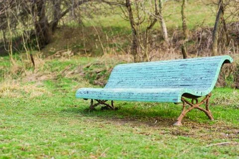 Lonely old blue bench in the spring Park Stock Photos