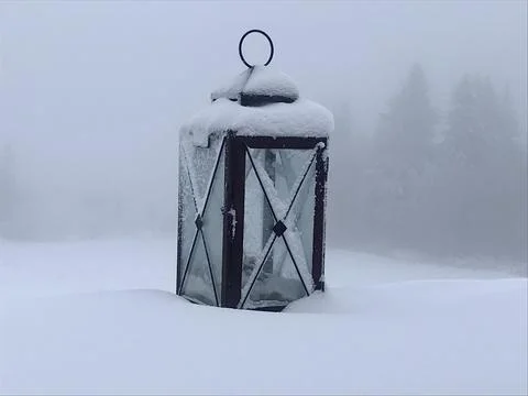 Lonely old lantern in the snow Stock Photos
