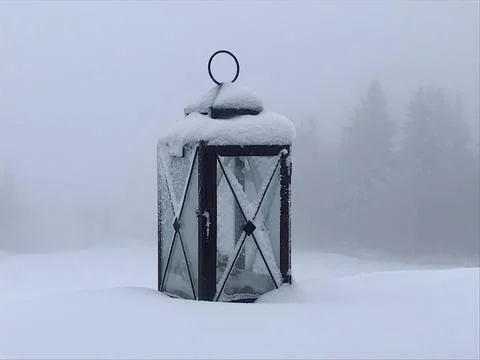 Lonely old lantern in the snow Stock Photos