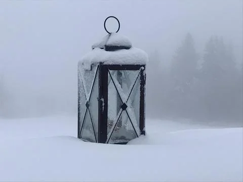 Lonely old lantern in the snow Stock Photos