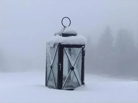 Lonely old lantern in the snow Stock Photos
