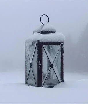 Lonely old lantern in the snow Stock Photos