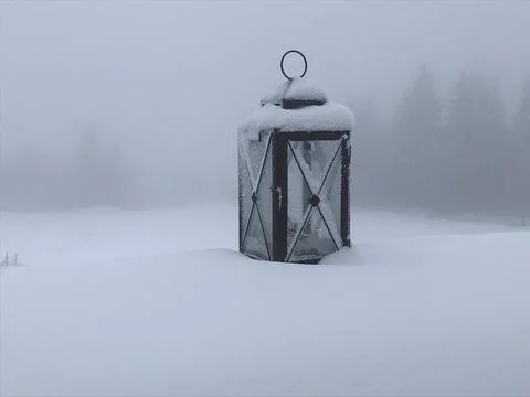 Lonely old lantern in the snow Stock Photos