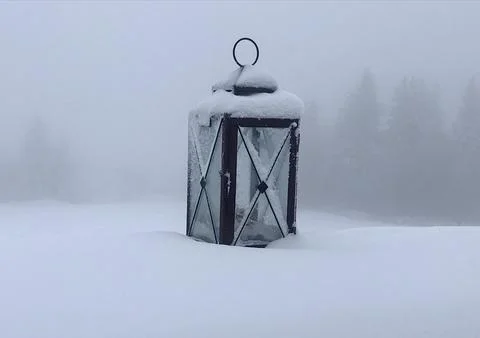 Lonely old lantern in the snow Stock Photos